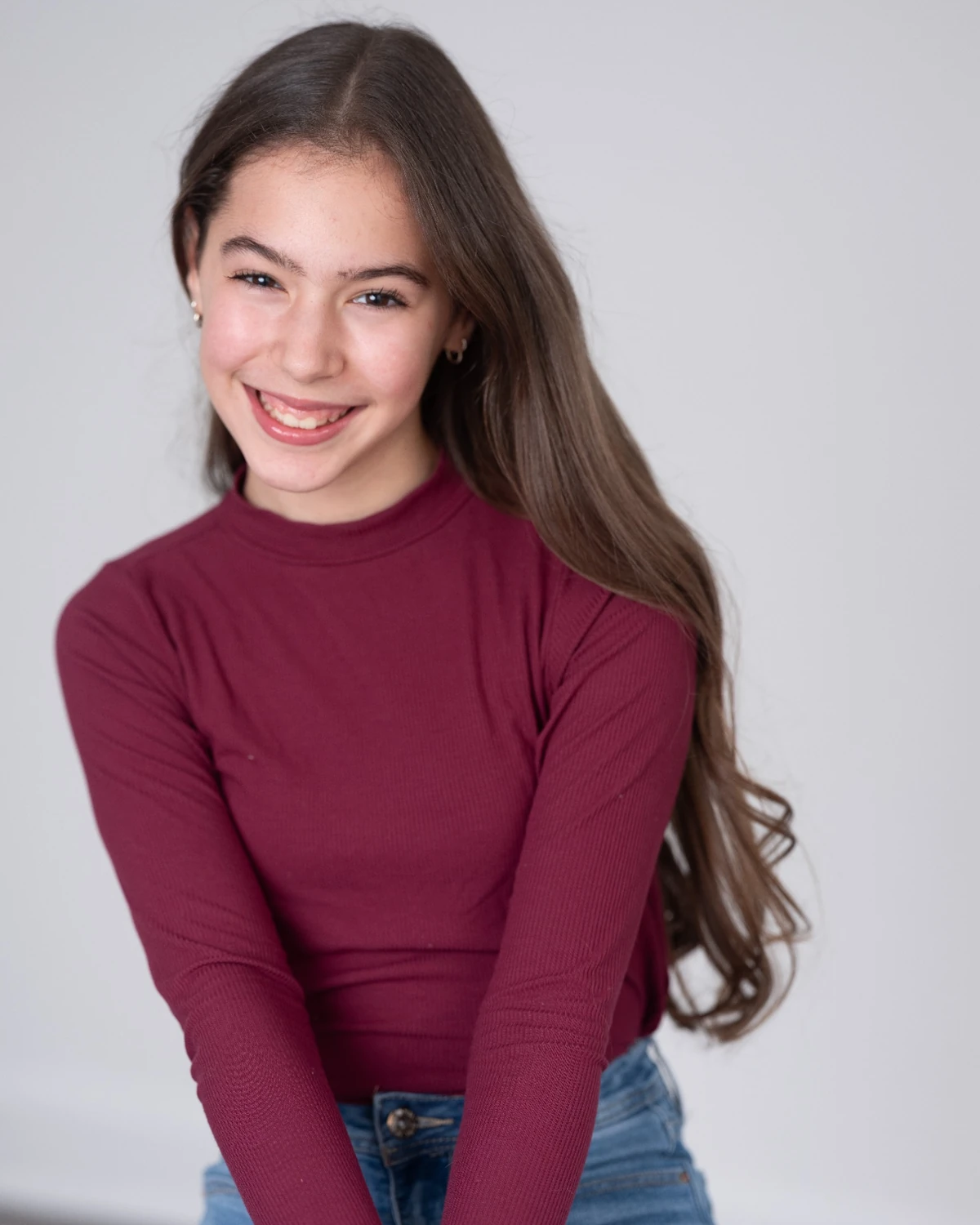 Samara headshot in a burgundy top